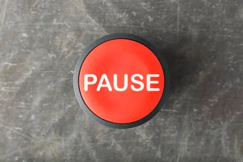 Overhead of Red Pause Push Button on Concrete Background Foto stock