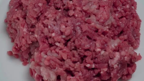 Overhead, Rotating Raw Ground Beef Meat on White Plate, Closeup 動画素材 134322894