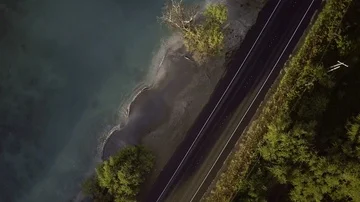 Overhead Rotating View Of An Oceanside Road Video stock 86039003