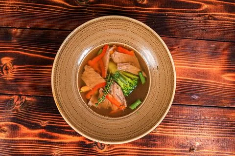 Overhead Rustic Meat and Vegetable Soup on Wood Stock Photos
