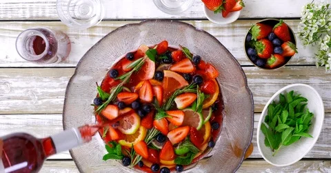 Overhead of sangria making with fresh fruit and mint 스톡 동영상 81444904