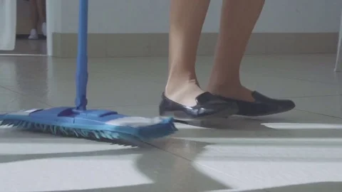 Overhead shoot of cleaning lady dancing with a broom 스톡 동영상 74516712