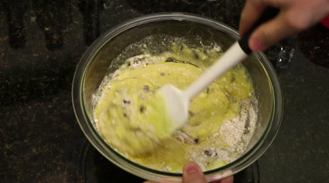 Overhead shot of batter being stirred in mixing bowl Stock Footage 61404473