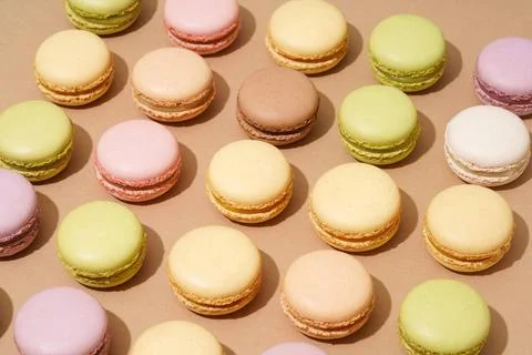 An overhead shot of a beige table surface featuring an array of colorful m... Foto stock