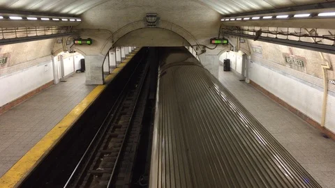 Overhead shot of Bronx 1 subway train leaving subway station. View from top of Stock Footage 91218448