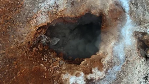 Overhead shot of a bubbling geyser hole in the Atacama Desert. Stock Footage 345763331