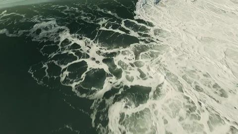 Overhead shot captures turbulent ocean surf and foamy crests Stock Footage 339790118