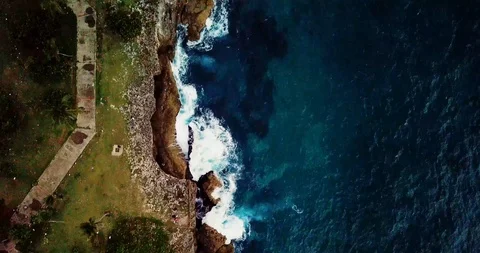 Overhead Shot of Cliffs and Waves Crashing Stock Footage 97360002