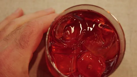 Overhead shot of a cocktail with ice cubes showing texture and color Stock Footage 332670299