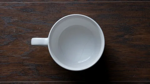 Overhead shot of coffee being poured and stirred Stock Footage 87891676