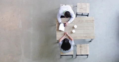 Overhead shot of a colleagues using a digital tablet in a business meeting Stock Footage 79141168