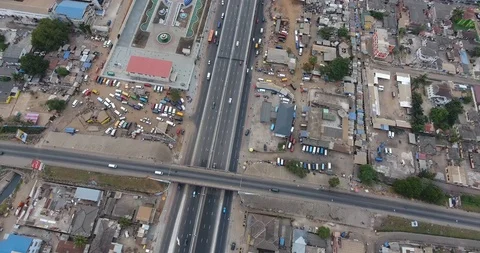 Overhead Shot of a dirty African road as drone pulls up - Ghana_3 Stock Footage