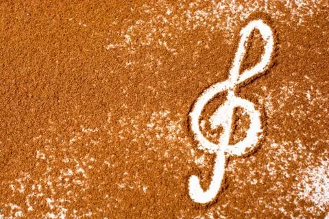 Overhead shot of a G-clef drawn on ground coffee with space for your text Stock Photos