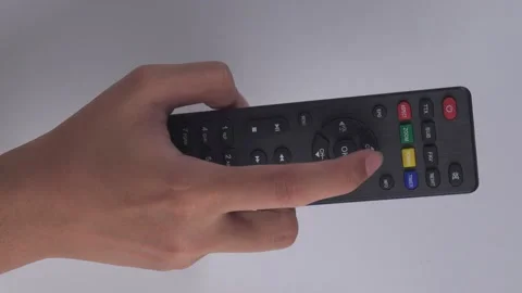 Overhead shot hands using tv remote isolated white background Stock Footage 276727109