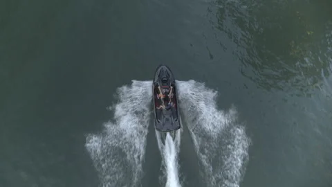 Overhead shot of jetski on the lake making waves Stock Footage 323466224