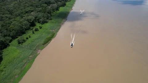 Overhead Shot of Local Guide boats cruising down the Amazon River in Brazil Vídeo Stock 169662999