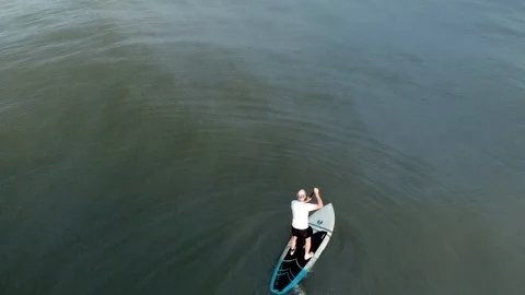 Overhead Shot Of Man Stand Up Paddle Boarding Stock Footage 94501865