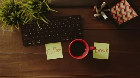 Overhead shot of man sticking notes with words "coffee break" on them and Stock Footage 81185176