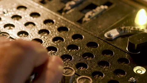 Overhead shot of a man using a WWII enigma code machine Stock Footage 263769126