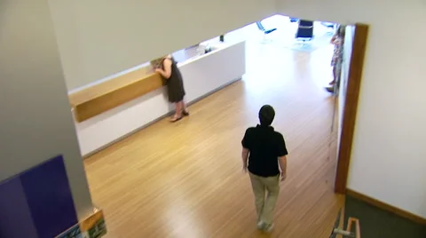 Overhead Shot of Man Walking In Office Stock Footage 45494781