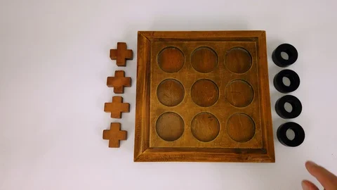 Overhead shot of the man's hands playing tic-tac-toe game. Stock Footage 128016826