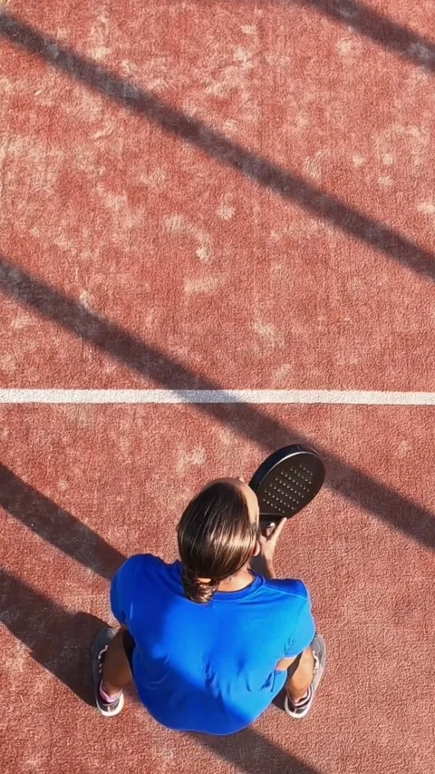 Overhead shot of a padel player marking imaginary lines with racket and hitting Stock Footage 313556895