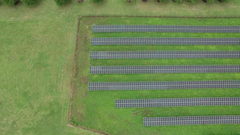 Overhead Shot Of Parallel Lines Set Of Solar Panels Built On Green Grass Stock Footage 221222573