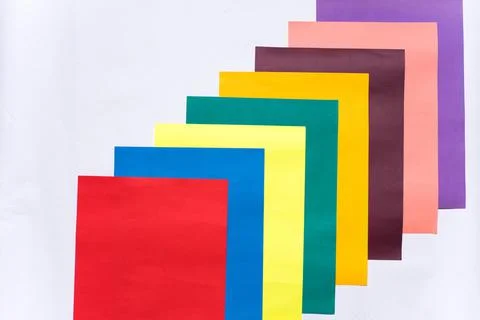 An overhead shot of a pattern with colorful papers stacked symmetrically on w イラスト素材