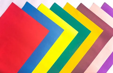 An overhead shot of a pattern with colorful papers stacked symmetrically on w イラスト素材