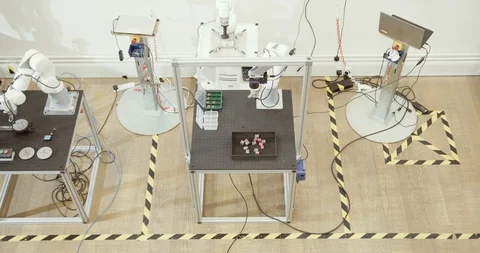 Overhead shot of robotic arm doing repetitive task Stock Footage 121706355
