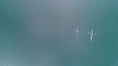 Overhead shot of rowing boats preparing for a competition on a pond Stock Footage 106400692