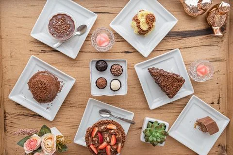 Overhead shot shows Assorted brazillian desserts on table Stockfoto's