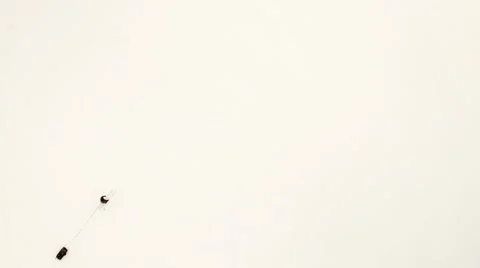 Overhead shot of a skier pulling a sleigh on white snow Video stock 61352128