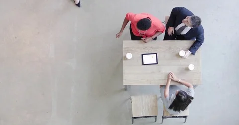 Overhead shot of a team using a digital tablet in a business meeting Stock Footage 79142322