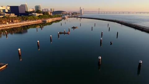 Overhead shot of tranquil harbor with city backdrop at Parque das Nacoes Video stock 345791021