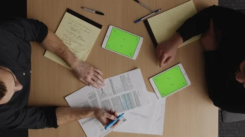 Overhead Shot of Two Coworkers Collaborating Stock Footage 124699856