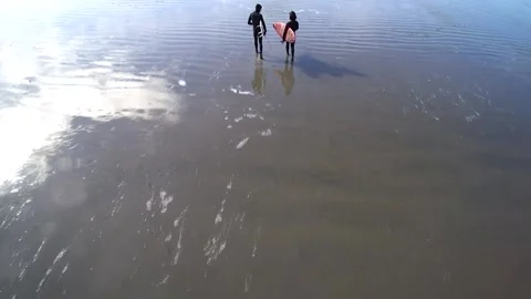 Overhead Shot Two Surfers Walking To Ocean Video stock 144566720
