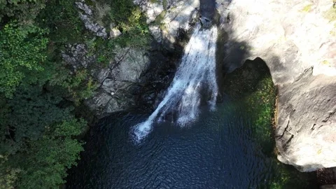 Overhead shot of two waterfalls, one of which is the Snake Waterfall in Genoa Stock Footage 317513302
