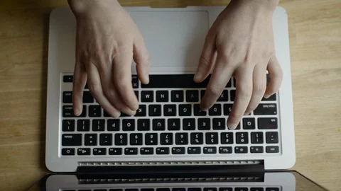 Overhead shot of typing on a laptop Stock Footage 127394574