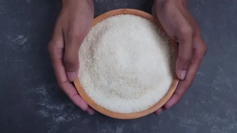 Overhead shot view of hand pick and putting down a bowl of sugar grain Stock Footage 281063870