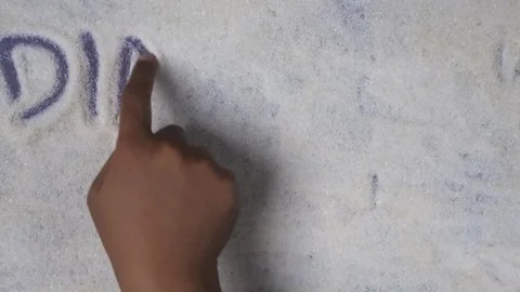 Overhead shot view of hand writing diabetes day word on sugar grains 库存影片 280748972