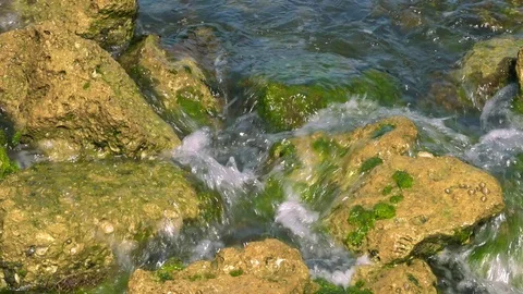 Overhead Shot of Waves Crashing Over Rocks, 4K Stock Footage 71215148