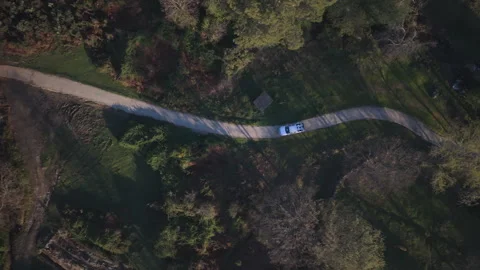 Overhead Side Tracking of Pickup on Winding Track Stock Footage 336562853