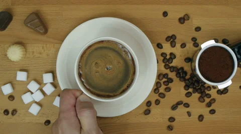 Overhead slide of fresh coffee picked up by male hand Stock Footage 66061607