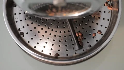 Overhead Slow Motion: Cooling Tray Agitating Freshly Roasted Coffee Beans Stock Footage 247660808