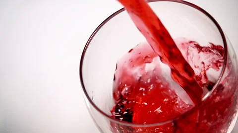 Overhead slow motion shot of cranberry juice pouring into glass Stock Footage 55327072