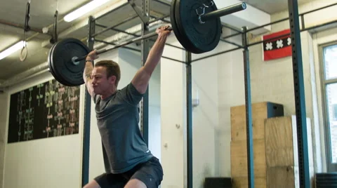 Overhead Squat Olympic Weightlifting Movement at a CrossFit Box Stock-Footage 40034207