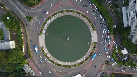 Overhead static drone shot of roundabout and fountain central Jakarta, Indonesia Stock Footage 78572966