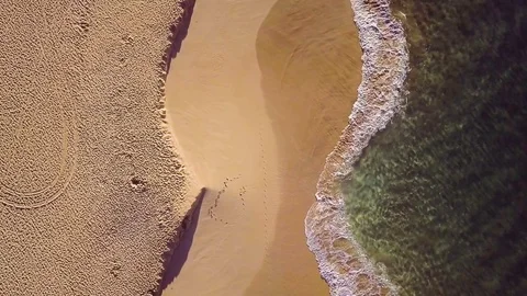 Overhead Static Shot Of Waves Crashing Gently On A Sandy Tropical Beach Stock Footage 83959783