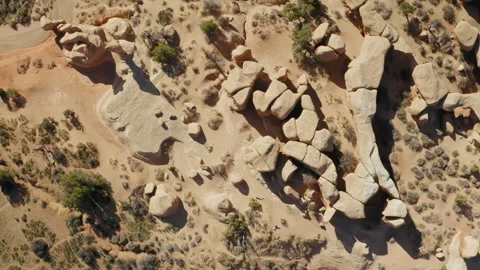 Overhead straight down view moving across rock formations at Devil's Garden Stock Footage 248558523
